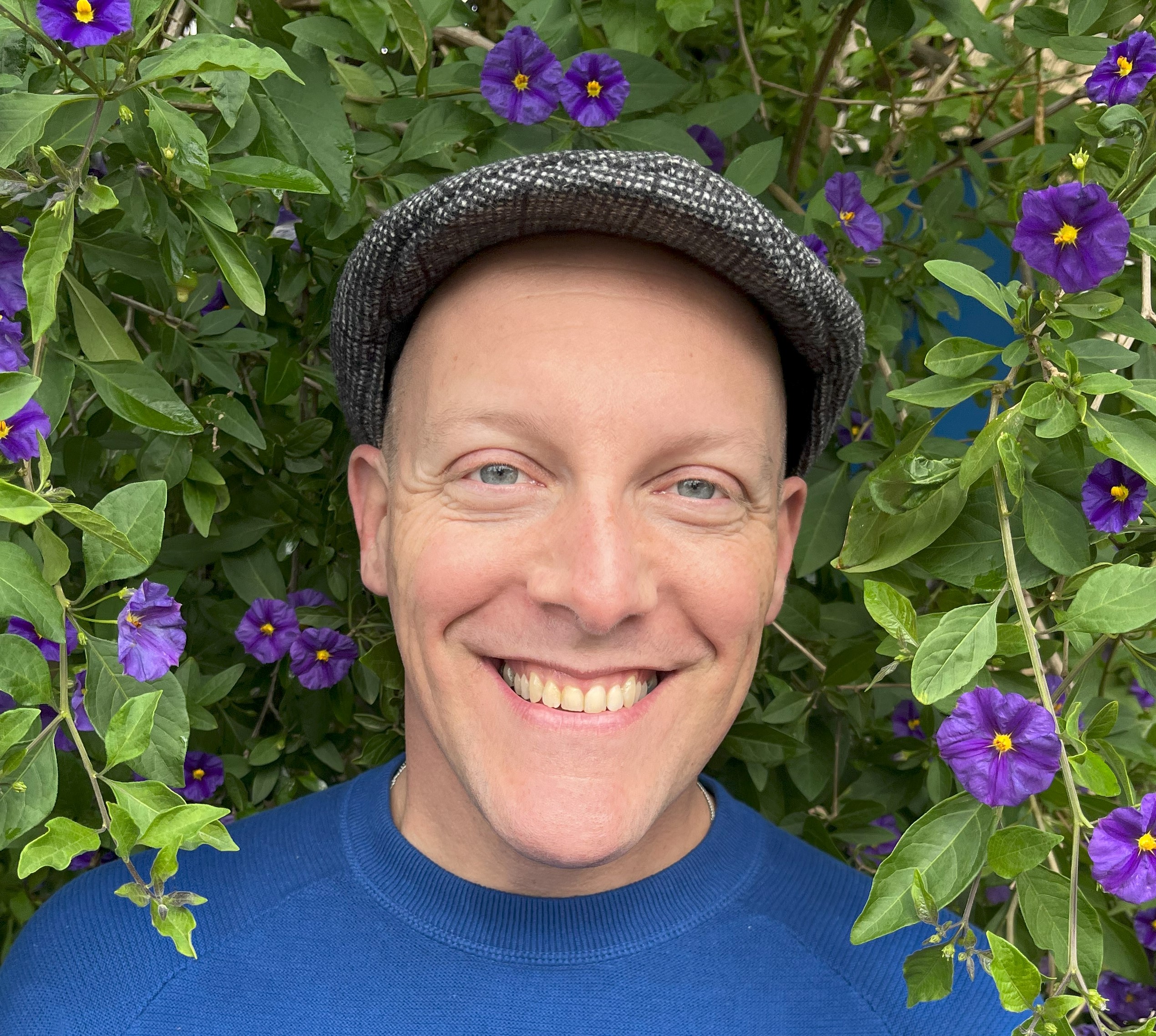 David-Headshot-Flowers-zoomed-in-1